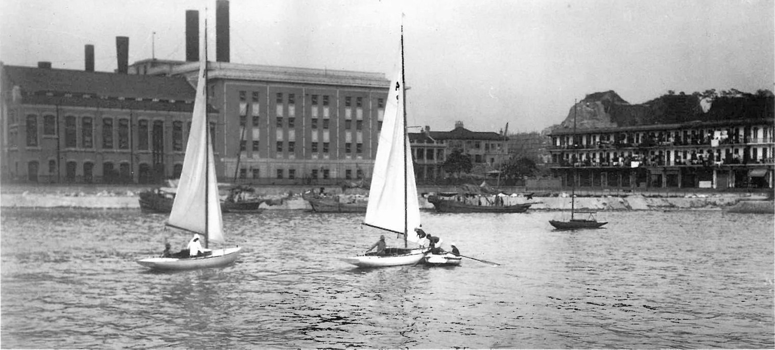Historic 1933 photo of two sailboats near a shoreline at North Point.
