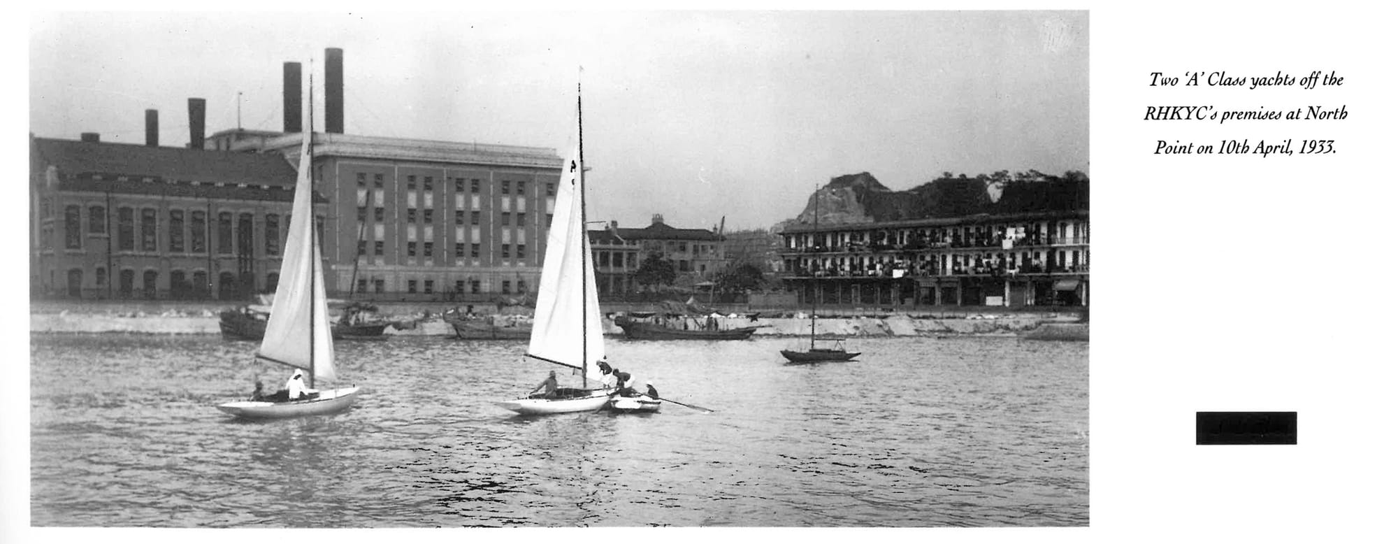 Historic 1933 photo of two sailboats near a shoreline at North Point.