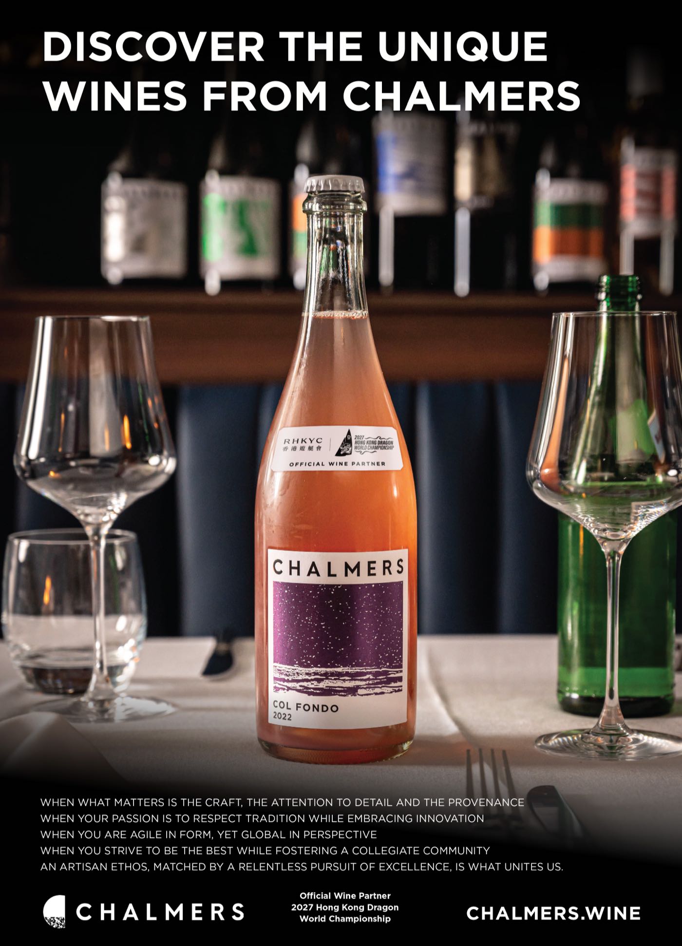A bottle of Chalmers Col Fondo sparkling rosé on a laid table, its neck label reading Official Wine Partner