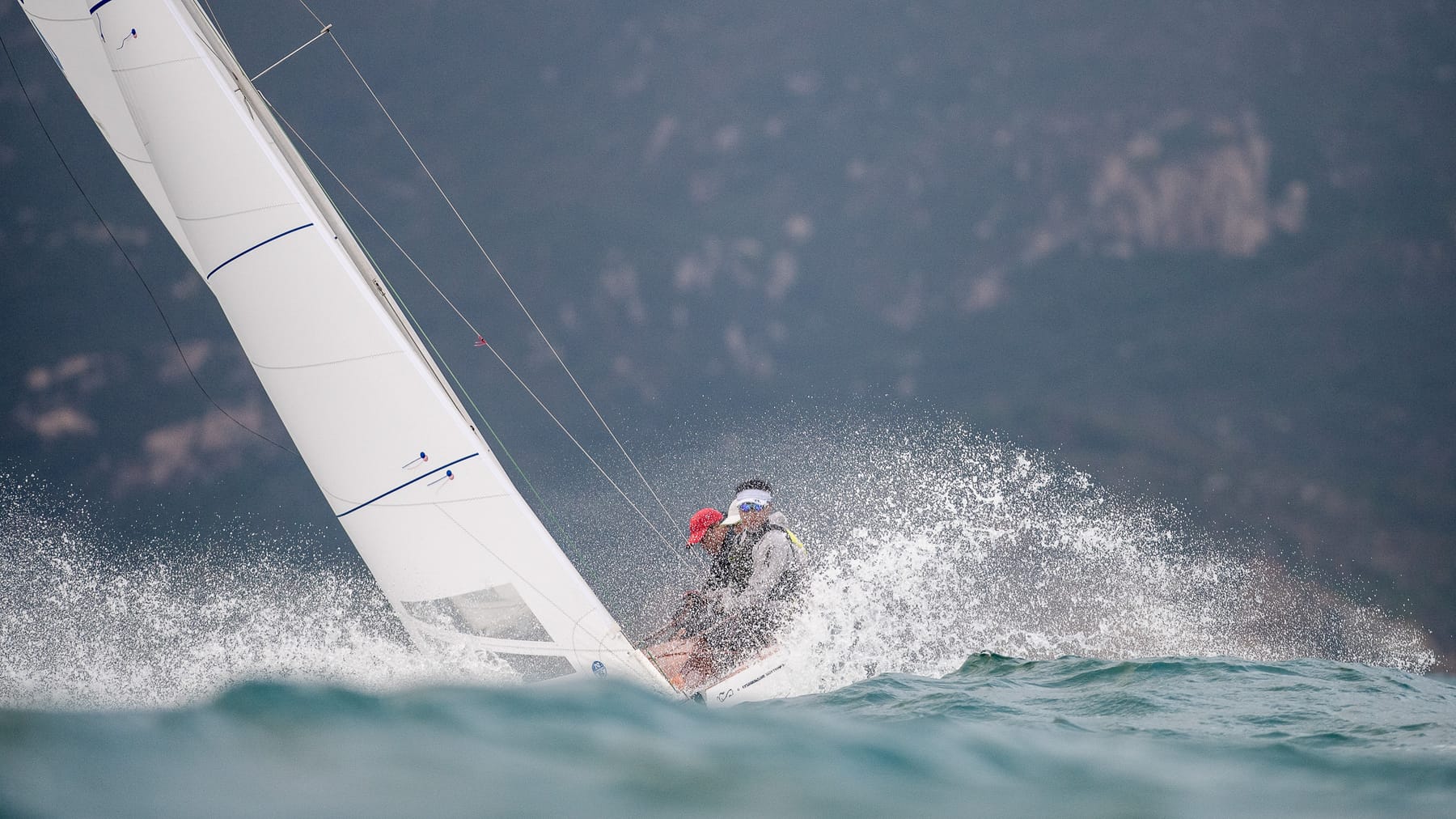 Aerial view of a Dragon under spinnaker in Hong Kong waters