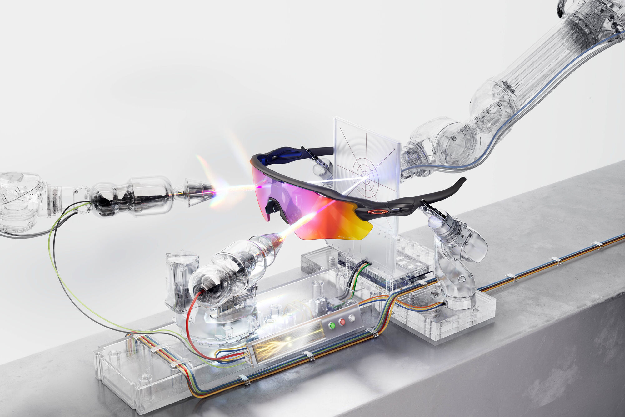 A single-lens Oakley sports sunglass on an optical bench, glass robotic arms firing beams of light through its Prizm lens onto a target plate