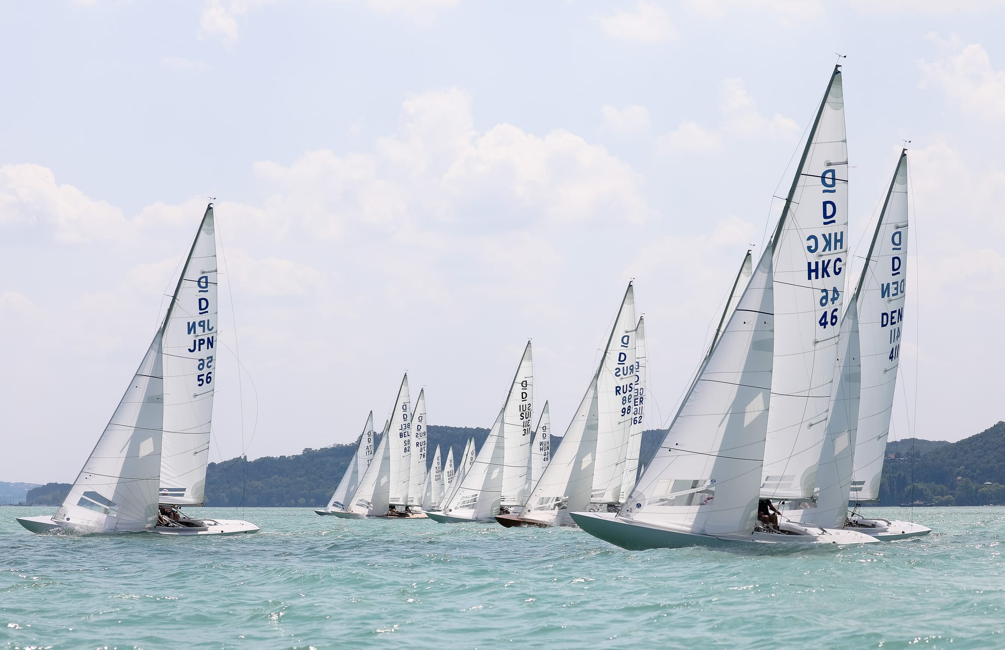 Dragon fleet racing upwind under full sail