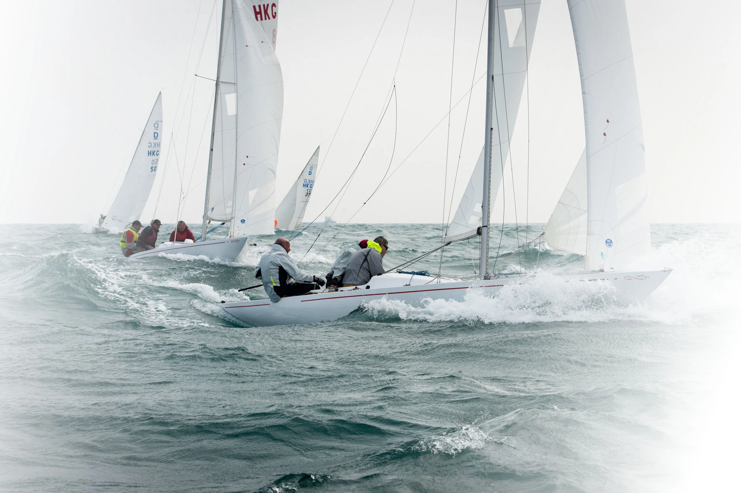 Dragon keelboats racing in the South China Sea near the Ninepins Islands.